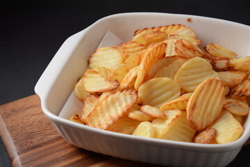 Homemade rippled potato chips and sauce, ketchup