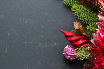 Holiday decorations and evergreen branches left on the table.