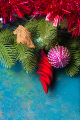 Holiday decorations and evergreen branches left on the table.