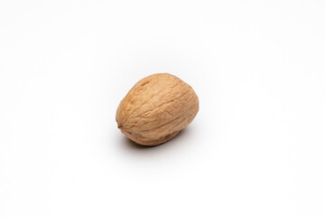 One walnut on white background