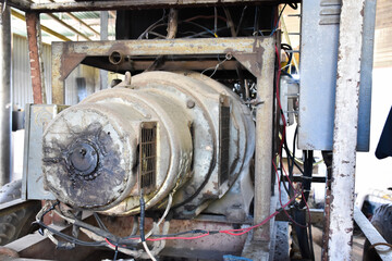 An ancient generator for using in the gas station when a power cut, which is still working today,...