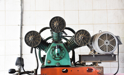 An ancient generator for using in the gas station when a power cut, which is still working today,...