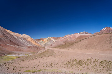 dry and arid desolation in the high andes mountains, with colorful mountains and rocks. desert landscape in high altitude in Argentina, South America