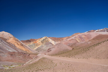 dry and arid desolation in the high andes mountains at the Agua Negra pass, with colorful mountains and rocks. desert landscape in high altitude in Argentina, South America