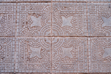 Details of white antique tiles with fine lines of decoration in mediterranean style like in Italy or Spain
