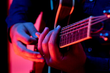 Guitar player with red and blue 