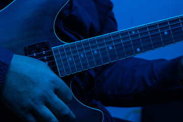 guitar player with blue light