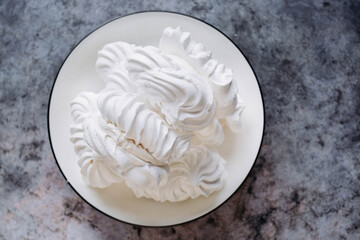 Meringue. Sweet meringues. Meringue tray. Close up photo of meringues. Dessert Background.