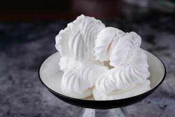 Meringue. Sweet meringues. Meringue tray. Close up photo of meringues. Dessert Background.
