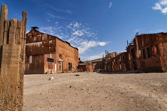 collapsed building with corrugated tin walls of an old saltpeter mining town in the Atacama desert of Chile, South America