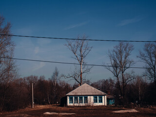 one-story house in a small town in spring