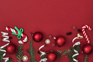 New Year's, festive decor on a red background. Copy space, flat lay, mock up, top view