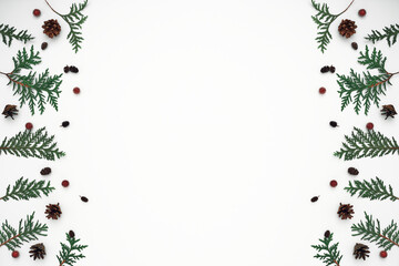 Thuja branches, spruce and New Year's decor. Copy space, flat lay, mock up, top view.