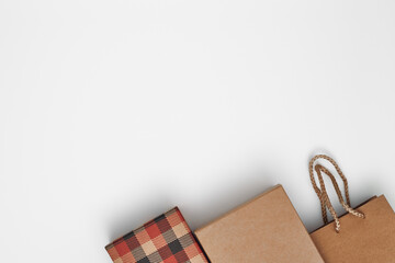 Gift boxes and gift bag on a white background. Black Friday. Copy space, flat lay, mock up, top view.