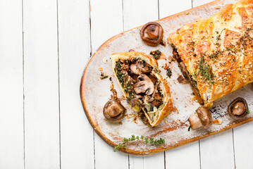 Sliced pie with mushrooms