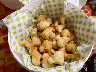 Pettole or pittule. Bullets of very soft leavened dough fried in boiling oil, typical of the...