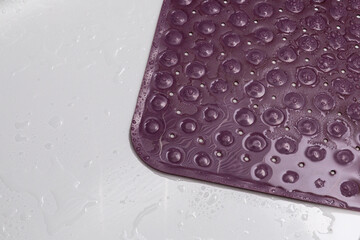 top view wet purple bath mat