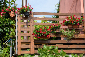 Fototapeta na wymiar Balcony of a villa with flower pots, Italy.