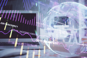 Financial graph colorful drawing and table with computer on background. Double exposure. Concept of...
