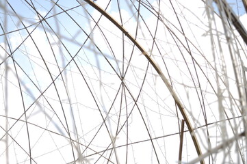 Fototapeta premium Abstract flashing wires on sky background
