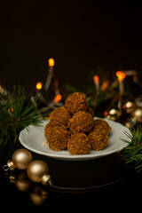 honey dessert and christmas decorations on black background