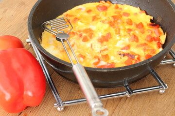 delicious omelette with paprika in a pan