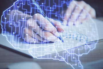 Multi exposure of writing hand on background with brain hologram. Concept of learning.