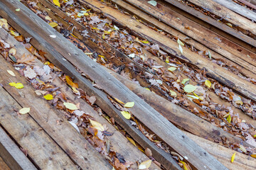 Heap of long wooden boards for the construction and improvement of the yard