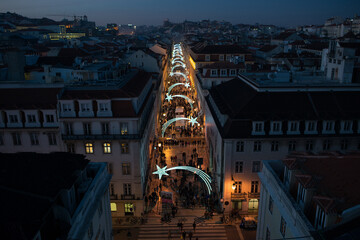 High angle view from above to Rua Augusta street in Lisbon at night illuminated with falling stars...