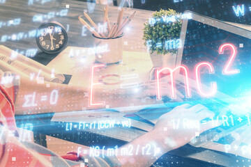 Science formula hologram with man working on computer on background. Education concept. Double...