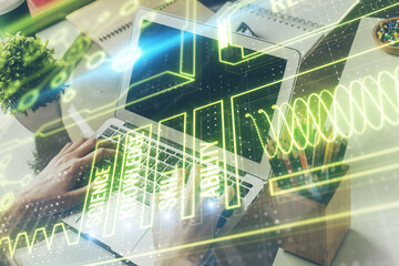 Science hologram with man working on computer on background. Concept of study. Double exposure.