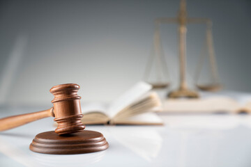 Law and justice concept. Gavel, legal code and scale on the off-white background.