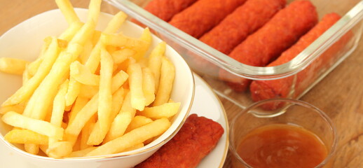 Fototapeta na wymiar delicious french fries with cevapcici rolls and dip