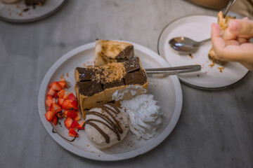 Blurred background view Of the dessert menu (Honey Toast) that contains ice cream, whipped cream, sour fruit like strawberries to be decorated and served to the customer.