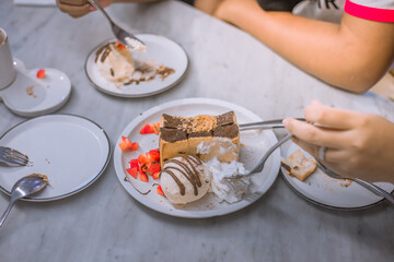 Blurred background view Of the dessert menu (Honey Toast) that contains ice cream, whipped cream, sour fruit like strawberries to be decorated and served to the customer.