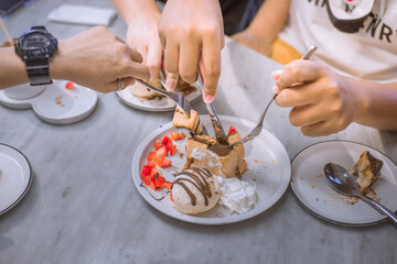 Blurred background view Of the dessert menu (Honey Toast) that contains ice cream, whipped cream, sour fruit like strawberries to be decorated and served to the customer.