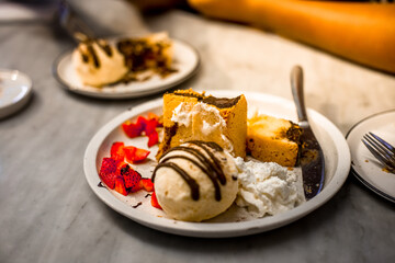 Blurred background view Of the dessert menu (Honey Toast) that contains ice cream, whipped cream, sour fruit like strawberries to be decorated and served to the customer.