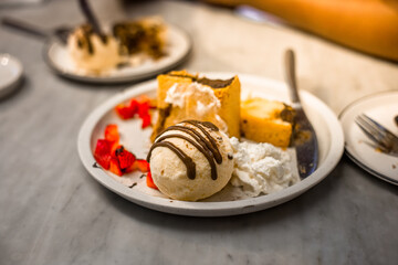 Blurred background view Of the dessert menu (Honey Toast) that contains ice cream, whipped cream, sour fruit like strawberries to be decorated and served to the customer.