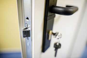 Shallow depth of field (selective focus) image with a metal door lock.