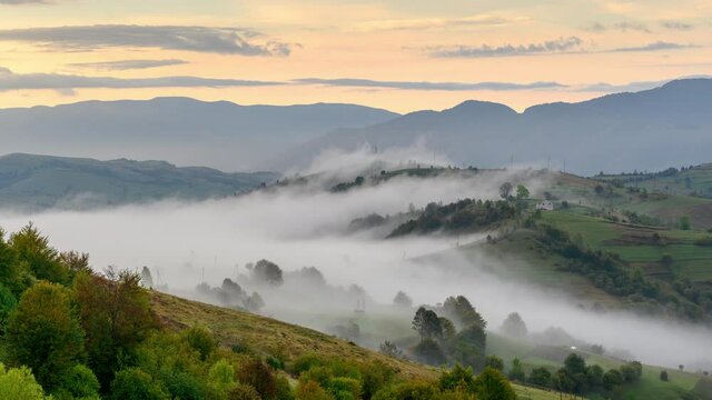 Time laps Beautiful morning fog in the Mountains. Dawn. Forest landscape with cloud and fog.