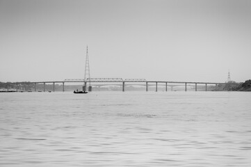 Panoramic View of the River Ganga with Bridge Over It in Black & White