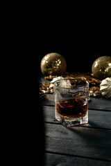 Glass of cognac and christmas background