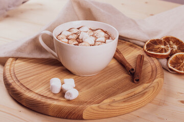 tasty sweet hot chocolate in a cup and mini marshmallows