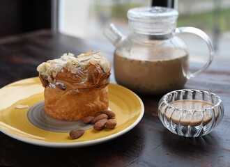 Tasty almond cake with herbal tea