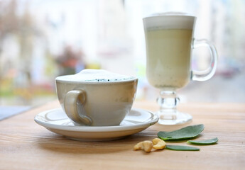 Coffee latte on a wooden cafe table