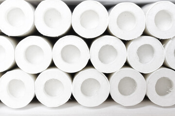 Lots of white cigarette acidic filters with an air chamber. Close-up. Background or backdrop.