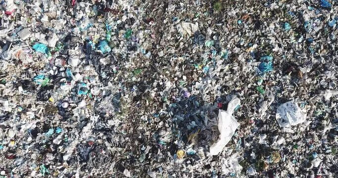 Aerial top drone view of large garbage pile, trash dump, landfill, waste from household dumping site, garbage background. Consumerism and contamination concept