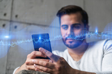 A man using smart phone. Double exposure. Forex graph hologram. Financial trading on-line brokerage concept.