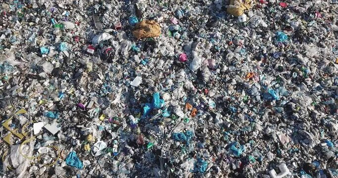 Aerial top drone view of large garbage pile, trash dump, landfill, waste from household dumping site, garbage background. Consumerism and contamination concept