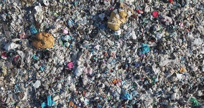Aerial top drone view of large garbage pile, trash dump, landfill, waste from household dumping site, garbage background. Consumerism and contamination concept
